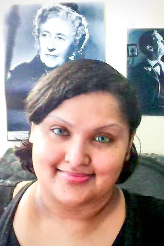 A photograph of author Rima Ray